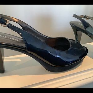 Nine West navy patent leather open toe pumps.